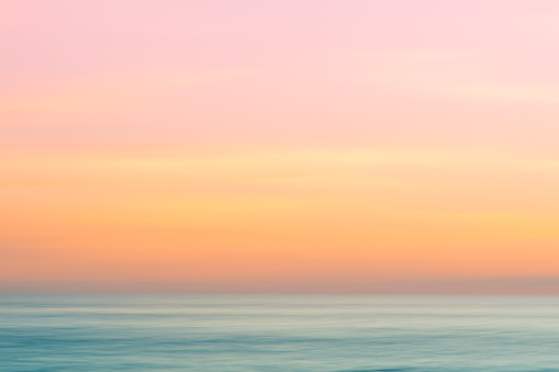 Abstract subset sky and  ocean nature background with blurred panning motion.