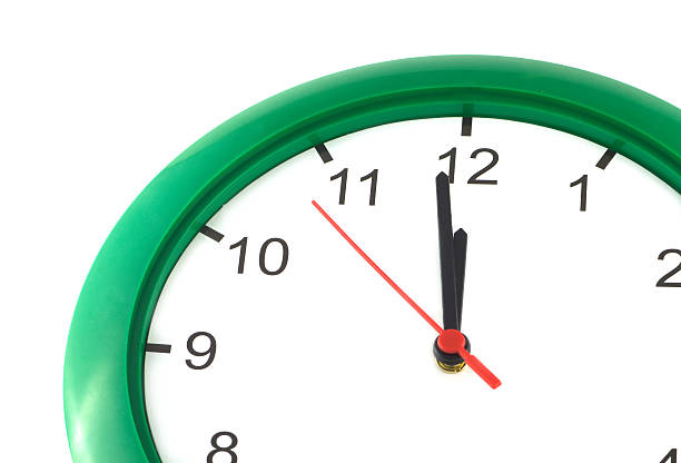 istock Twelve o'clock on big wall watch isolated 521575547