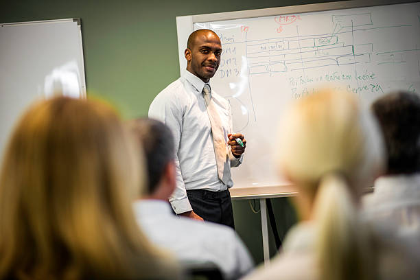 istock Young Businessman Presenting His Ideas to Colleagues 521575849