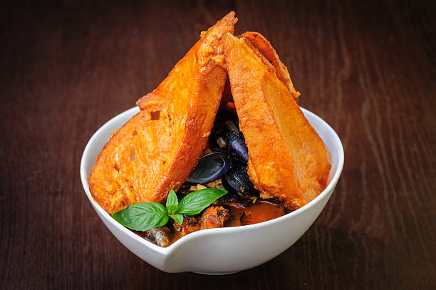 istock mussel soup with toasted bread 521576473