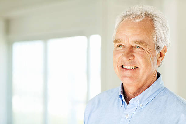 istock Happy Senior Man Looking Away At Home 521577493