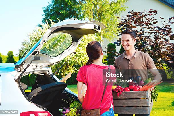 Young Couple Standing Outdoor By Car Came Back From Shopping Stock Photo - Download Image Now