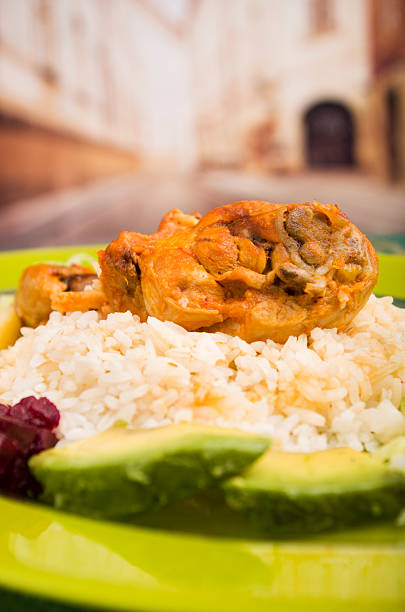 istock chicken served with white rice potato on a plate 521577707