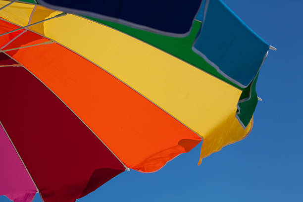 istock Colorful umbrella against the blue sky 521578889