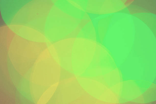 istock High resolution imag of colored blurred dots on dark background. 521579223