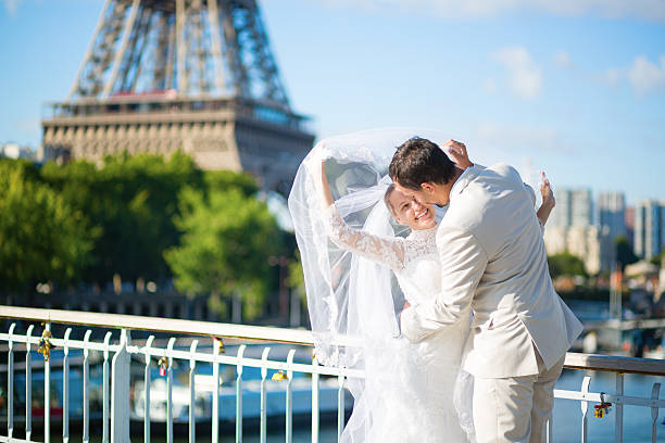istock Bride and groom in Paris, near the Eiffel tower 521580639