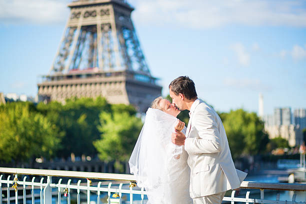 istock Bride and groom in Paris, near the Eiffel tower 521580641