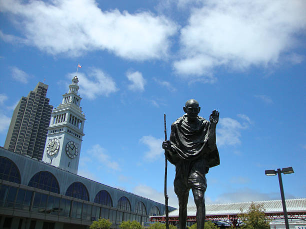 Statue of Peace activitist Ghandi By The Ferry Building San Francisco, USA - July 6, 2010: Statue of Peace activitist Ghandi By The Ferry Building in San Francisco, California. July 6. 2010. indian man walking in park stock pictures, royalty-free photos & images