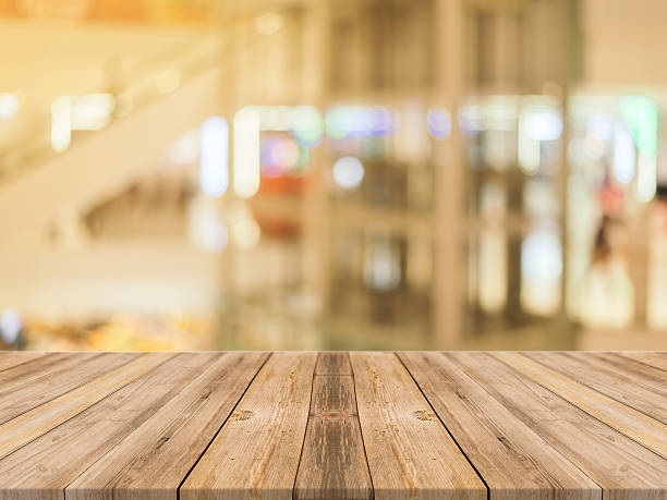 istock Wooden board empty table blur in department store background. 521601938