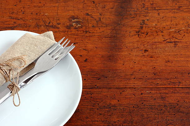 istock Seasonal white wooden table with cutlery 521603086