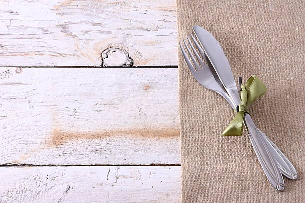 istock Seasonal white wooden table with cutlery 521604432
