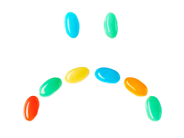 istock Upset sad smiley made of multicolored candies 521605276