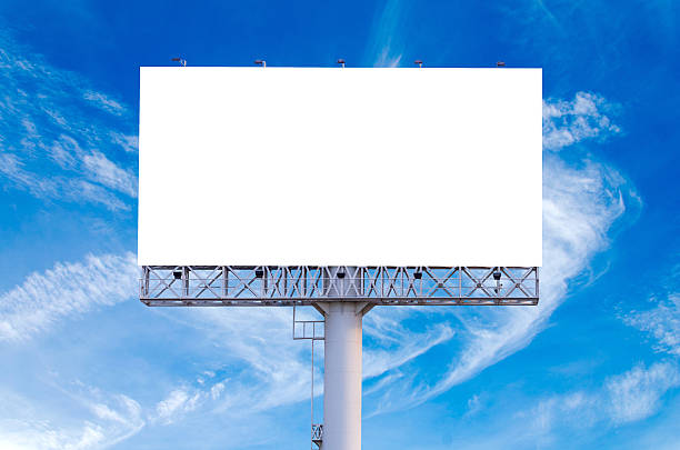 istock Blank billboard ready for new advertisement with blue sky backgr 521605560