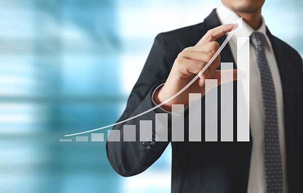 istock Businessman with financial symbols coming 521605698