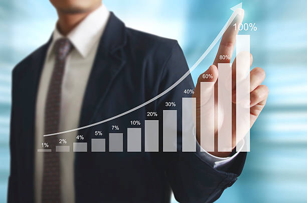 istock Businessman with financial symbols coming 521605766