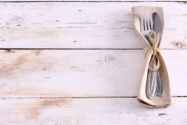 istock Seasonal white wooden table with cutlery 521606444