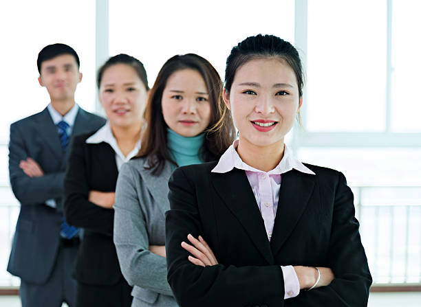 istock Group of businesspeople standing in a line 521607752