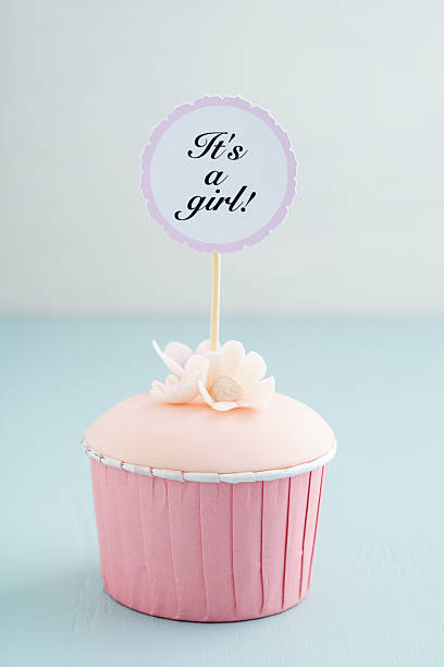 istock Baby shower girl cupcake 521609188