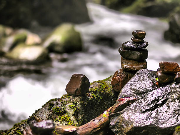 istock Stone Pile on rock with river in background 521609300