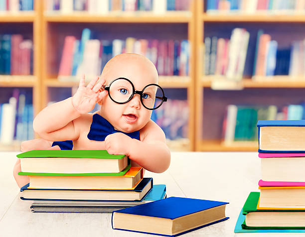 Baby in Glasses Read Books, Smart Kid Early Development and Education, Library Book Shelves