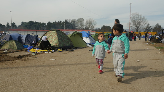 Idomeni, Greece - March 6, 2016: Refugee children are seen at the makeshift refugee camp in Idomeni, near the Greece-Macedonian border.
