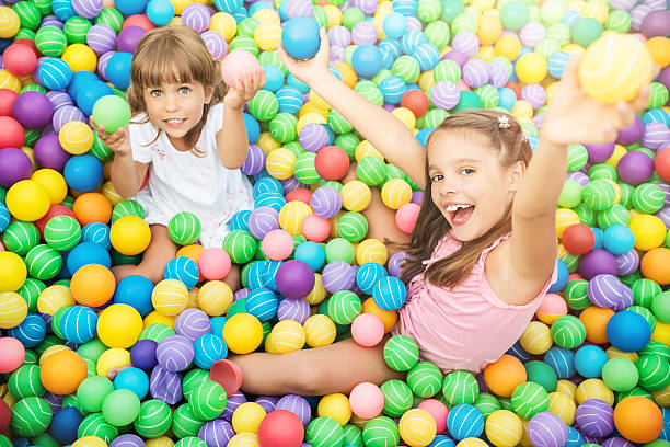 istock Girls in ball pool 521610580