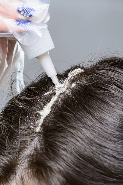istock Woman paints her hair 521611016