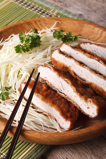 Tonkatsu Japanese breaded deep fried pork with cabbage closeup.