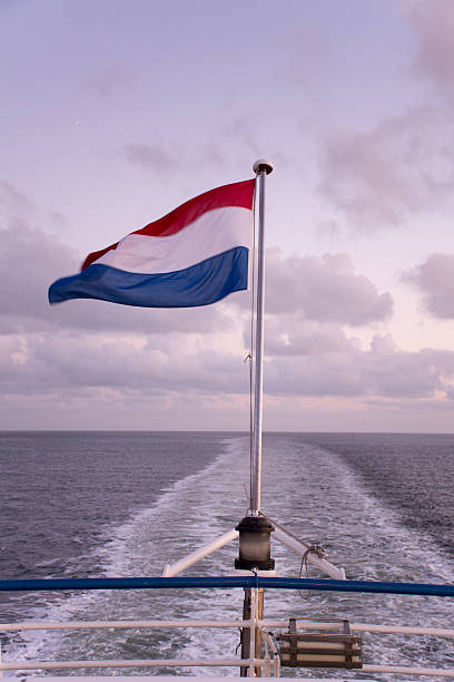 istock Dutch flag on the back of a ship 521614186