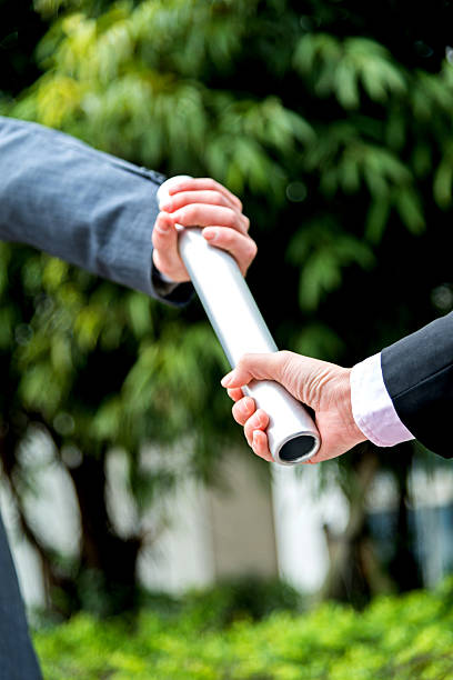 istock Business people passing baton 521614198