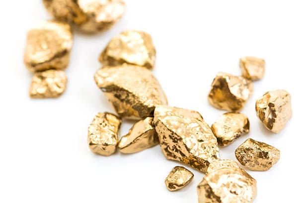istock handful of gold nuggets close-up 521614746