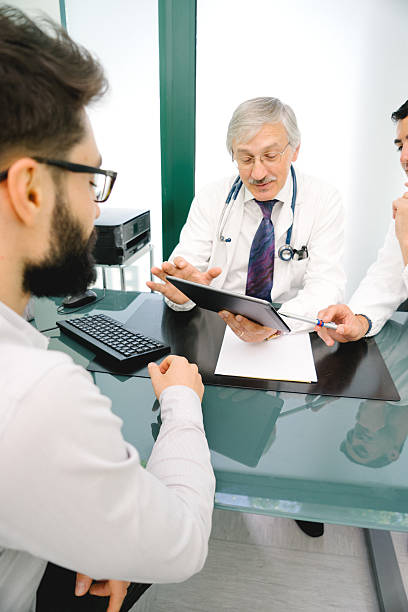 istock Mature Male Doctor Using A Digital Tablet For His Diagnosis. 521616536