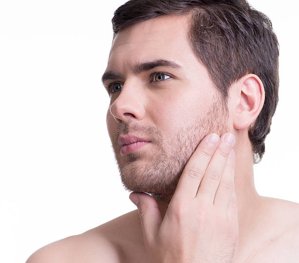 istock Handsome man with hand near the face 521617112