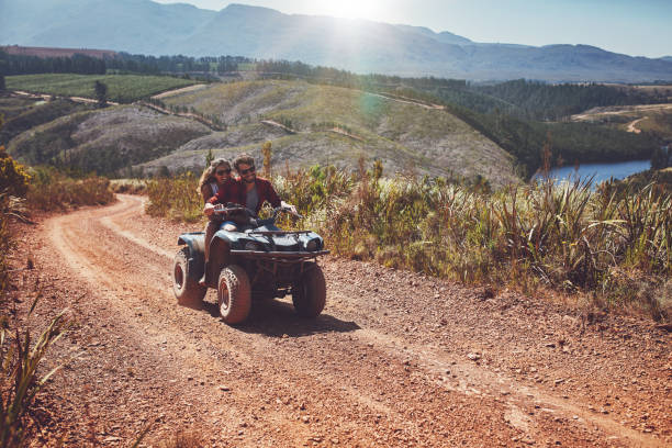 istock Young couple enjoying off road vehicle ride 521617626
