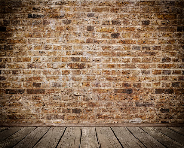 istock Old brick wall and wooden floor. 521617688