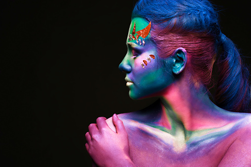 Portrait of beautiful woman with body art. underwater concept