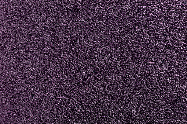 istock Purple and violet leather texture. Purple and violet leather bag. 521618062