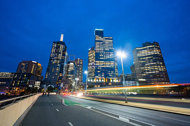 istock Modern buildings and traffic trails in downtown Melbourne 521618592