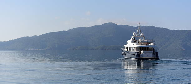 Motor yacht Belle Isle sailing to France from Turkey Mugla, Turkey - April 16, 2016: 24 meters motor yacht Belle Isle is sailing to France from Turkey. Photo is taken right after the yacht departed from Marmaris. belle isle stock pictures, royalty-free photos & images