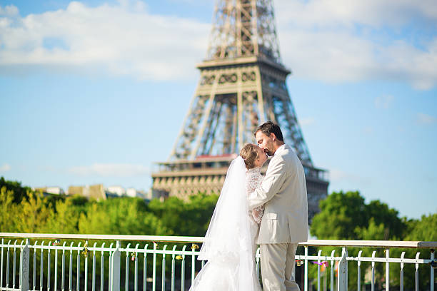 istock Bride and groom in Paris, near the Eiffel tower 521619399