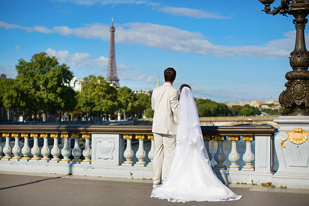 Beautiful just married couple in Paris, near the Eiffel tower