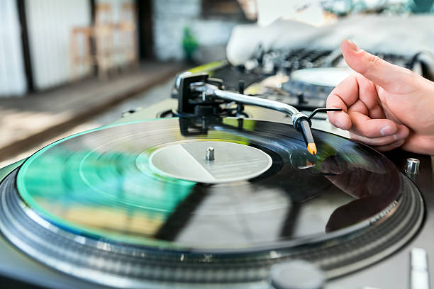 istock Dj mixes the track in club 521621417