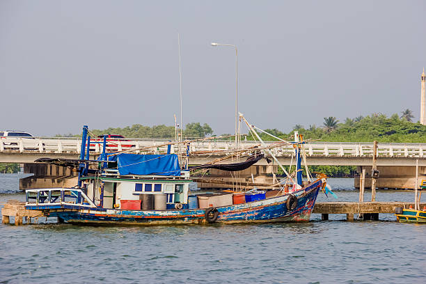 istock blue fishing boat on sea 521621949