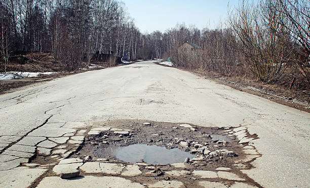 istock Large pit on the suburban road 521623134