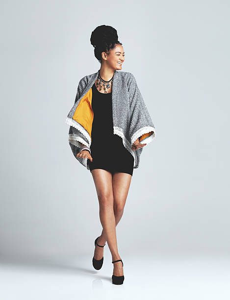 Feel good fashion Studio shot of a fashionable young woman posing against a grey background short weave hairstyles stock pictures, royalty-free photos & images