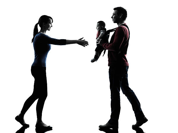 istock parents with baby silhouette 521623287