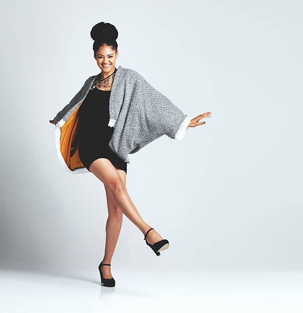 I'm an avid follower of fashion Studio shot of a fashionable young woman posing against a grey background short weave hairstyles stock pictures, royalty-free photos & images