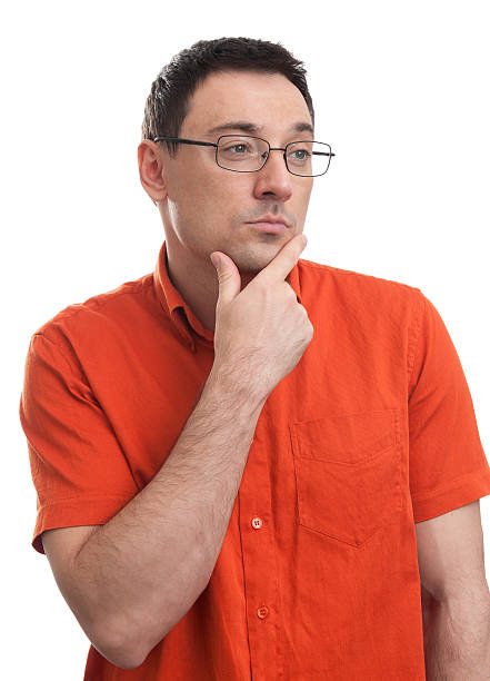 istock young thinking man with hand near face 521623717