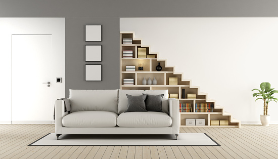 Contemporary living room with wooden staircase ,sofa and closed door - 3d rendering