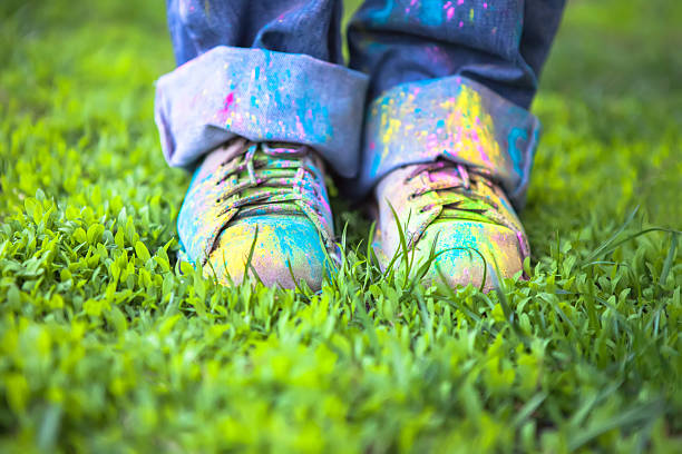 Bright dust on Vintage colorful shoes on green grass